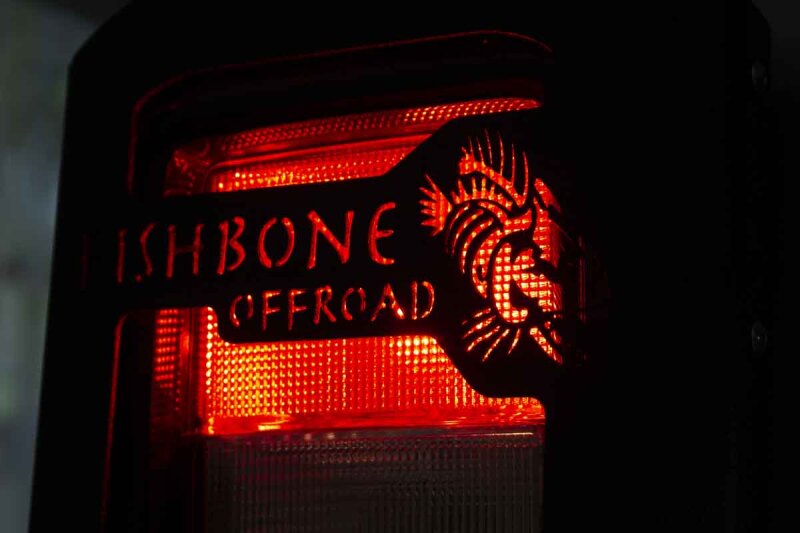 Jeep Wrangler Unlimited Tail Light Cover - Fishbone Offroad - Black textured powder coat - `18-`27